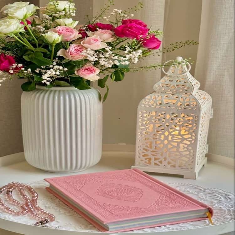 Elegant home decor with roses and ornamental lantern.