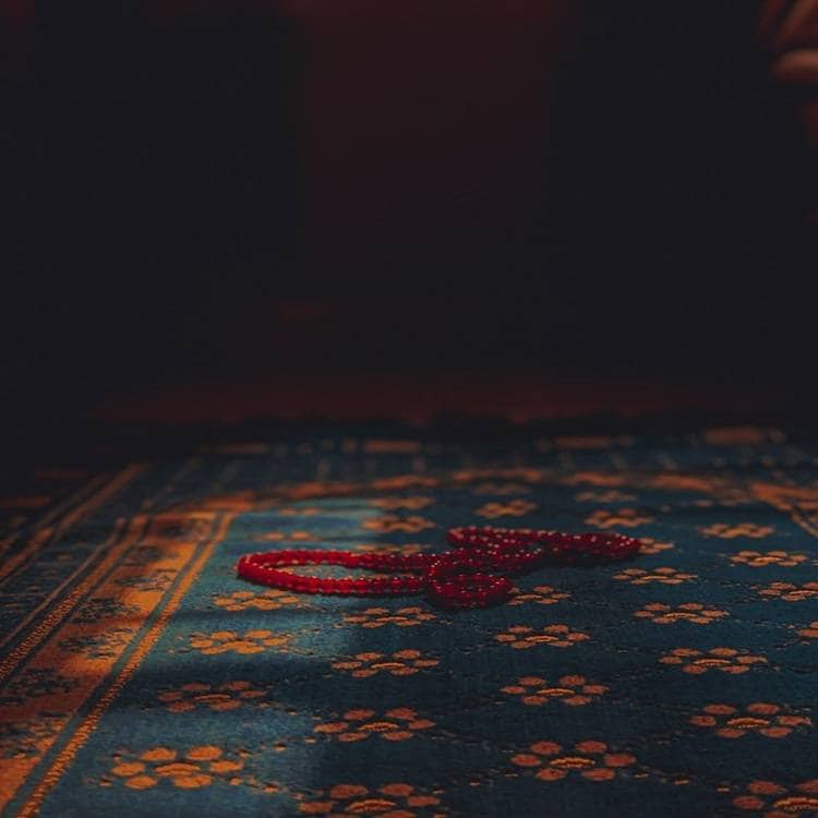 Red beads on traditional African patterned cloth.
